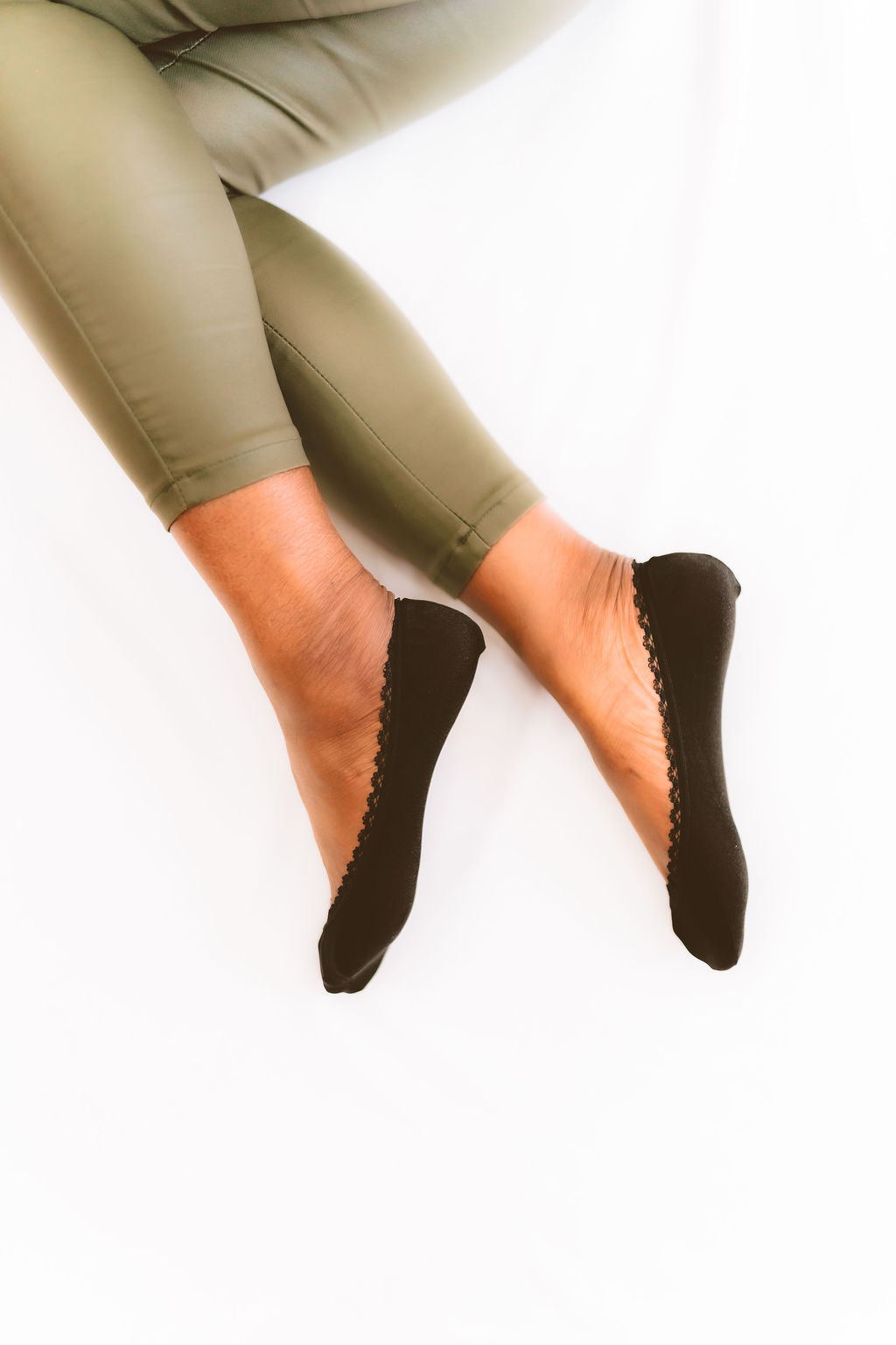 Black woman wearing black footies with casual pants - Arbella Style comfortable everyday look