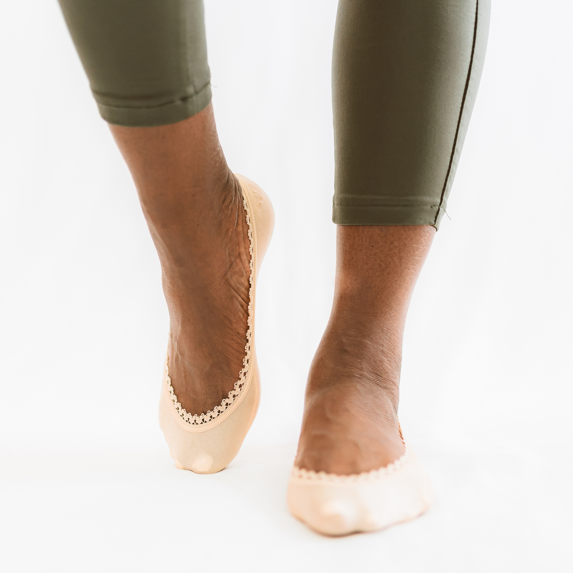 Black woman wearing nude/beige footies with casual pants - Arbella Style comfortable everyday look
