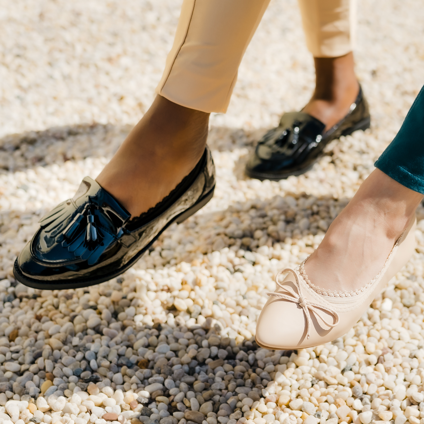Two women posing playfully in Arbella Style no-show footies - black loafers and nude shoes showing stay-put design