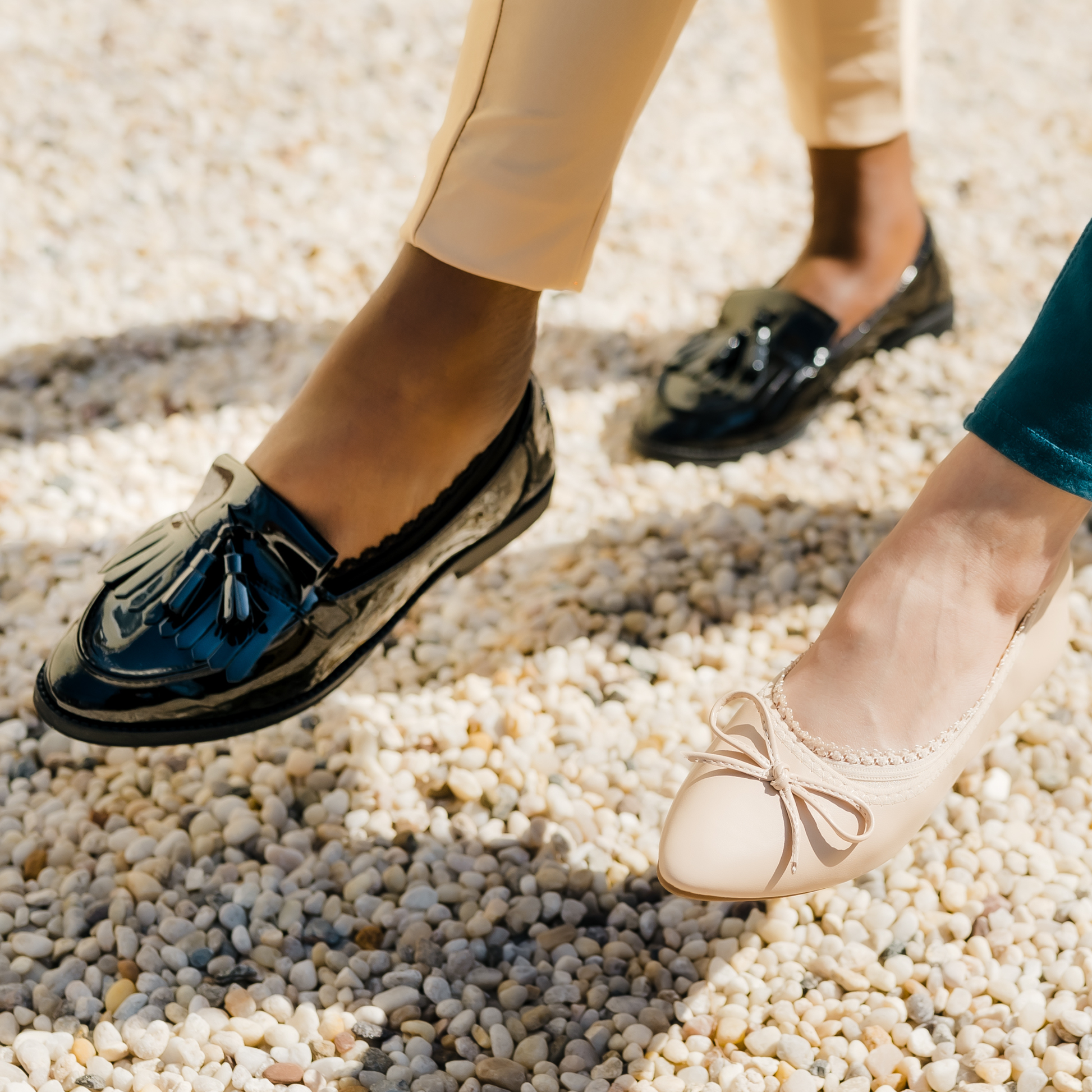 Two women posing playfully in Arbella Style no-show footies - black loafers and nude shoes showing stay-put design
