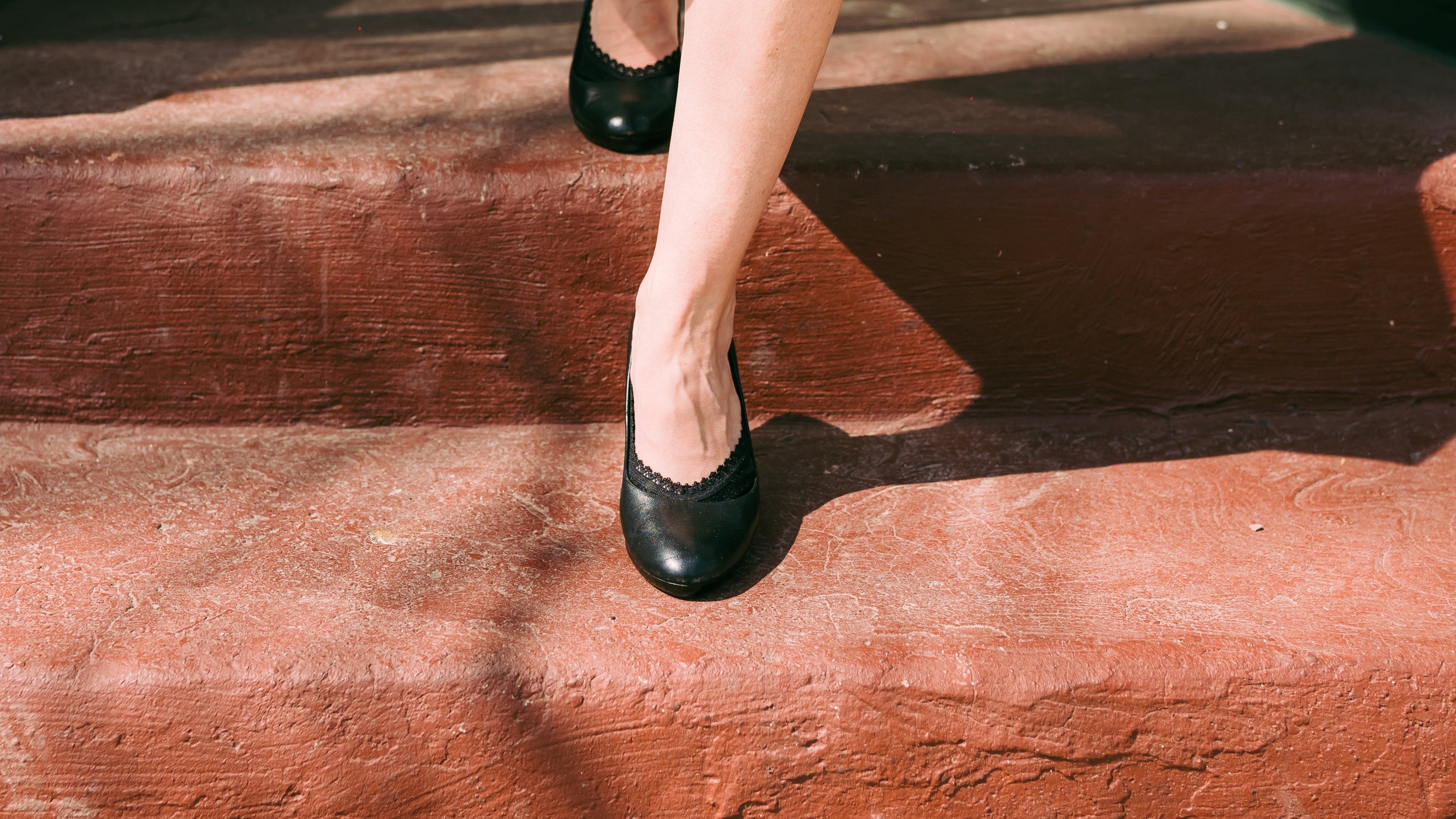 White woman wearing Arbella Style black footies with black heels - professional work look