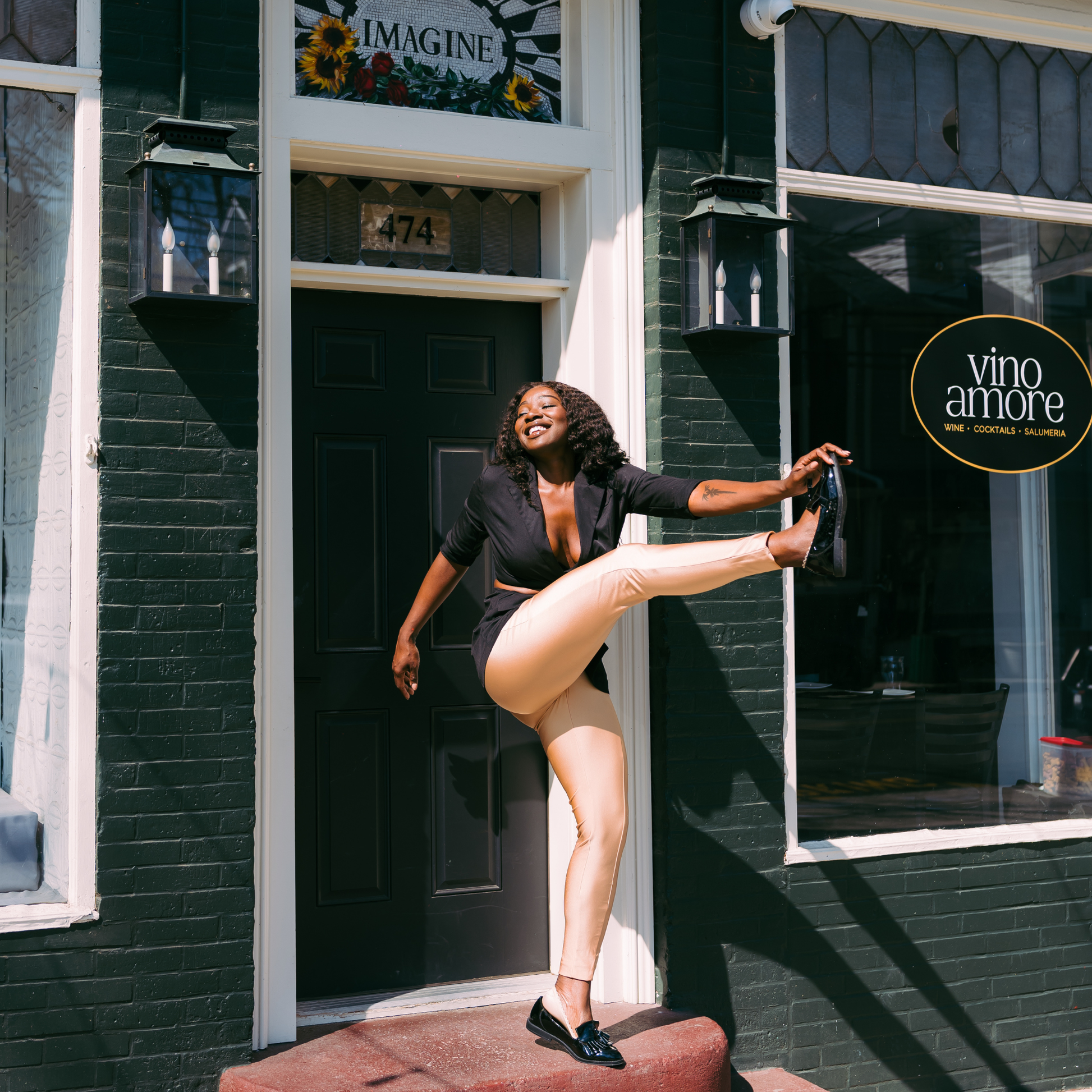 Woman kicking leg up showing Arbella Style stay-put footies - no-show socks that stay in place during movement